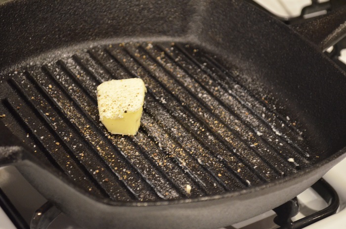 butter and salt the grill pan