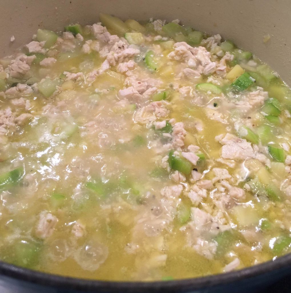 chicken in zucchini soup cooking