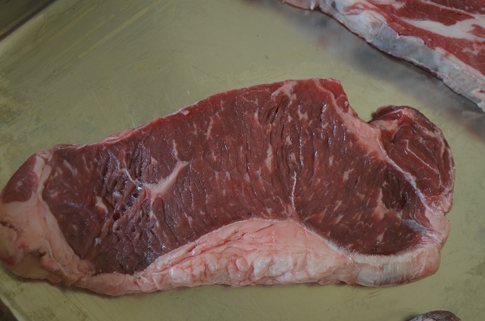 horizontal steak ny strip raw